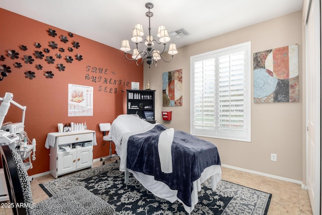 bedroom featuring a chandelier and light tile patterned floors