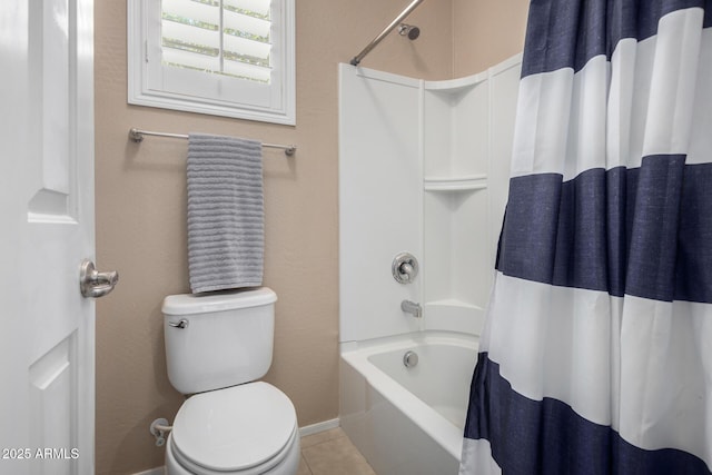 bathroom featuring toilet and shower / tub combo with curtain