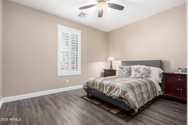 bedroom featuring ceiling fan and dark hardwood / wood-style flooring