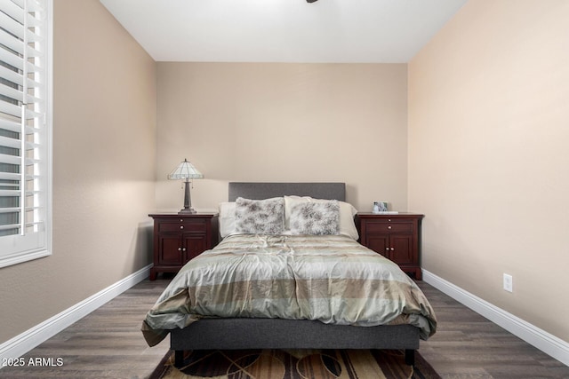 bedroom with dark wood-type flooring