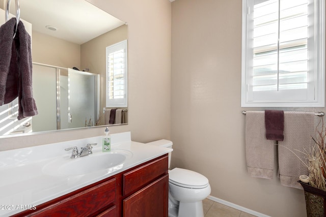 bathroom featuring tile patterned floors, vanity, an enclosed shower, and toilet