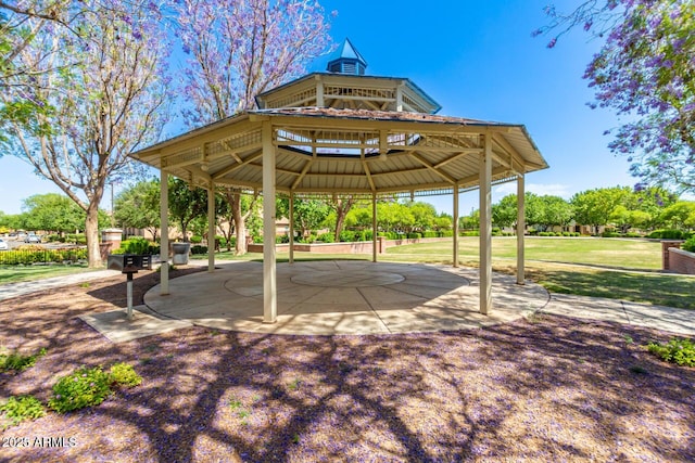 view of property's community with a gazebo and a lawn