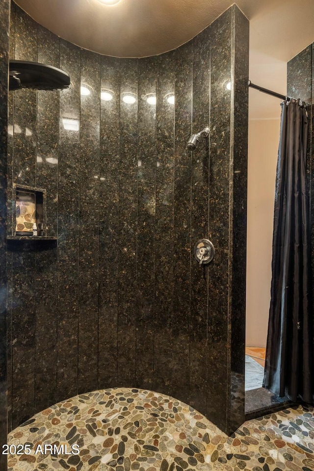 bathroom featuring a shower with curtain