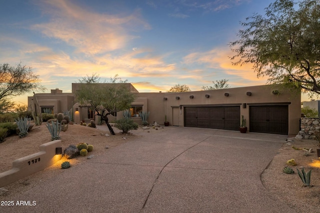 southwest-style home featuring a garage