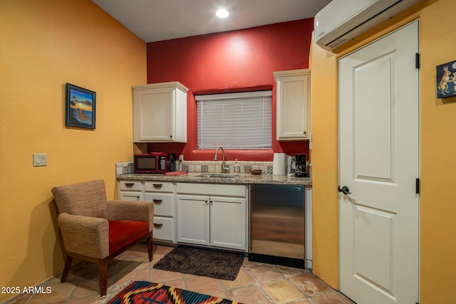 kitchen featuring dishwasher, sink, white cabinets, fridge, and a wall unit AC