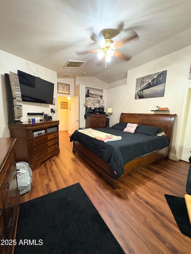 3418 W Maldonado Rd, Phoenix, AZ 85041 - bedroom with wood finished floors, vaulted ceiling, and a ceiling fan
