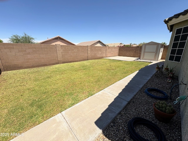 3418 W Maldonado Rd, Phoenix, AZ 85041 - view of yard featuring a patio area, a storage shed, and an outbuilding