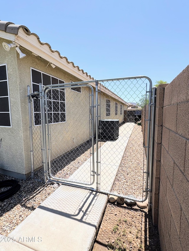 3418 W Maldonado Rd, Phoenix, AZ 85041 - view of patio with a gate, fence, and central air condition unit
