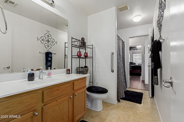 3418 W Maldonado Rd, Phoenix, AZ 85041 - full bathroom with toilet, vanity, tile patterned flooring, baseboards, and curtained shower