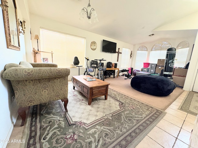3418 W Maldonado Rd, Phoenix, AZ 85041 - living area featuring vaulted ceiling, light tile patterned floors, and a chandelier