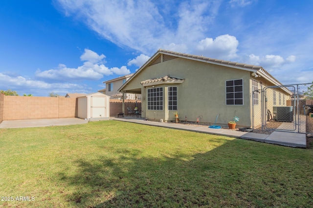 3418 W Maldonado Rd, Phoenix, AZ 85041 - back of property with a shed, cooling unit, a patio area, a gate, and an outdoor structure
