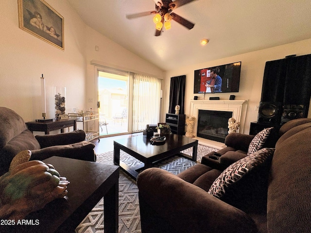 3418 W Maldonado Rd, Phoenix, AZ 85041 - living area featuring vaulted ceiling, a ceiling fan, and a glass covered fireplace