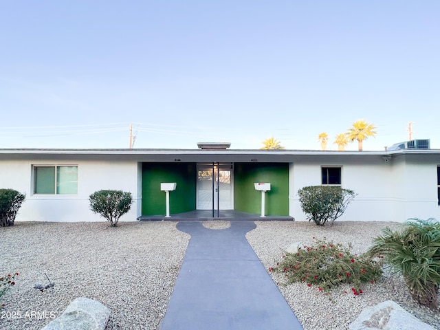 view of front of house featuring stucco siding