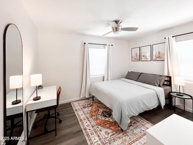 4132 N 3rd Ave, Phoenix, AZ 85013 - bedroom featuring multiple windows, a ceiling fan, baseboards, and dark wood-style flooring
