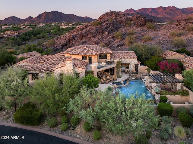 aerial view at dusk with a mountain view