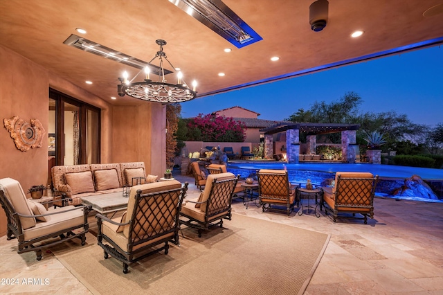view of patio with an outdoor living space and a fenced in pool