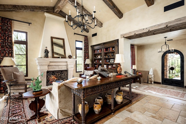 living room featuring high vaulted ceiling, a notable chandelier, beamed ceiling, and a fireplace