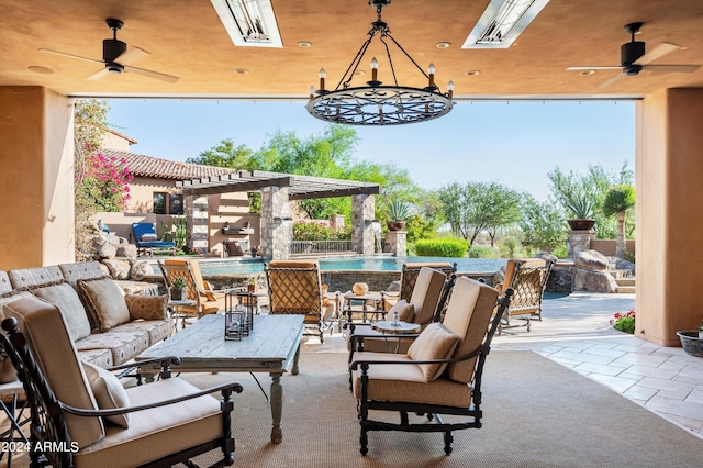 view of patio / terrace featuring outdoor lounge area, a fenced in pool, and a ceiling fan