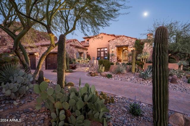 mediterranean / spanish-style house featuring a garage