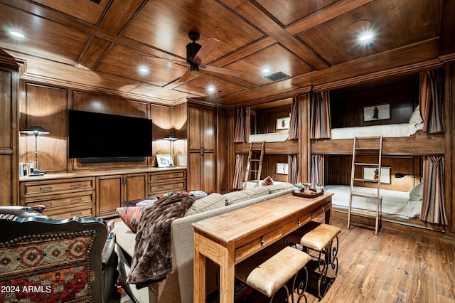 living room with hardwood / wood-style floors, wooden ceiling, wooden walls, and ceiling fan
