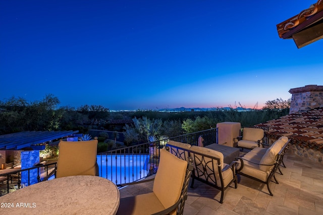 patio terrace at dusk with a balcony