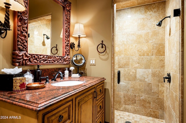 bathroom with vanity and a stall shower