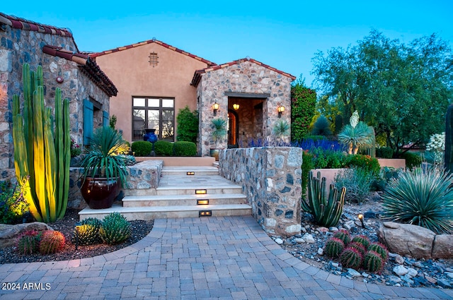 view of front of house with a fireplace