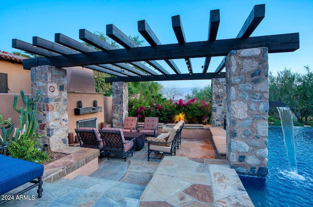 view of patio / terrace featuring exterior fireplace