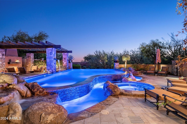 view of swimming pool featuring an outdoor fireplace, fence, a pergola, a patio area, and a pool with connected hot tub