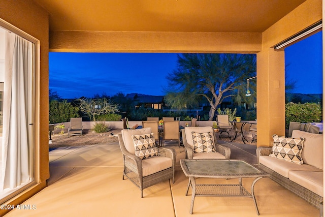 patio terrace at dusk with an outdoor living space