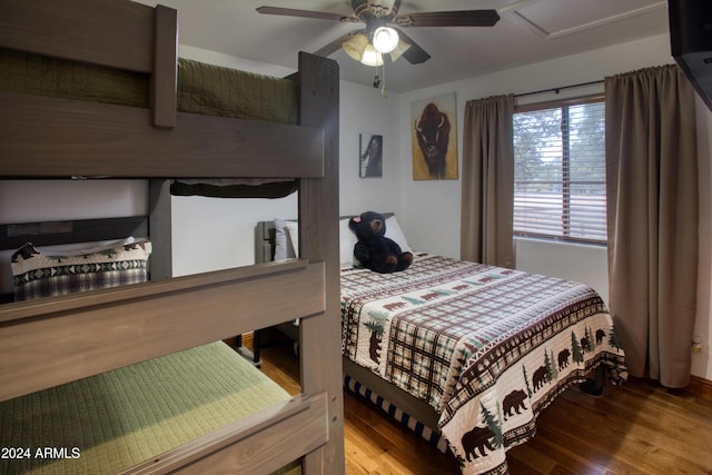 bedroom featuring hardwood / wood-style floors and ceiling fan