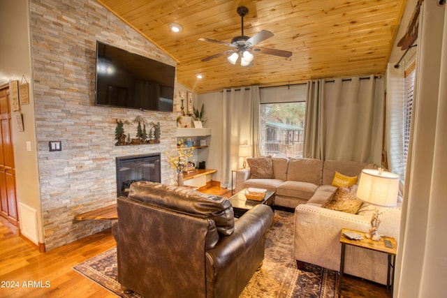 living room with ceiling fan, wood-type flooring, lofted ceiling, a fireplace, and wood ceiling