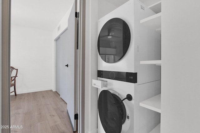 4600 N 68th St Unit 370, Scottsdale, AZ 85251 - washroom featuring estacked washer and dryer and wood finished floors