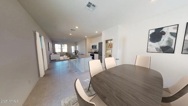 47136 W Coe St, Maricopa, AZ 85139 - dining room with recessed lighting, baseboards, and light tile patterned floors