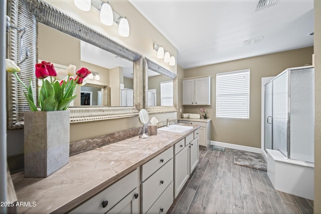 bathroom featuring vanity and walk in shower