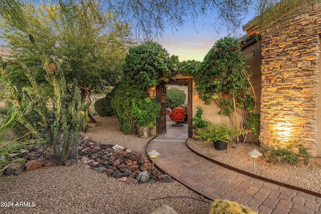 yard at dusk with a patio