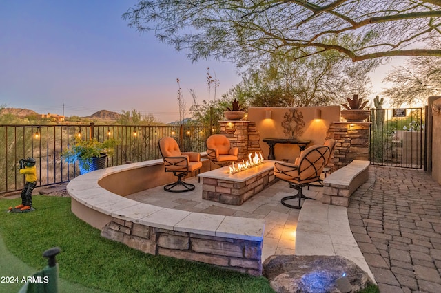 patio terrace at dusk with a fire pit