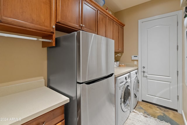 laundry area featuring washing machine and clothes dryer