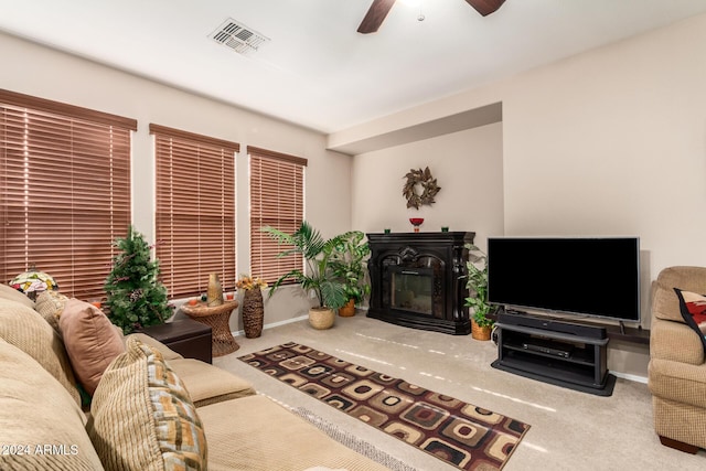 carpeted living room featuring ceiling fan