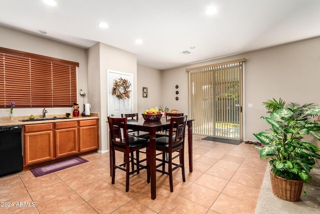 dining area featuring light tile patterned flooring and sink