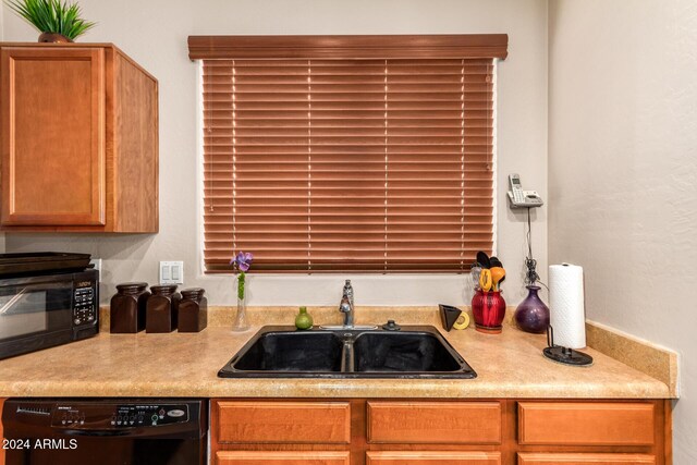 kitchen featuring black appliances and sink