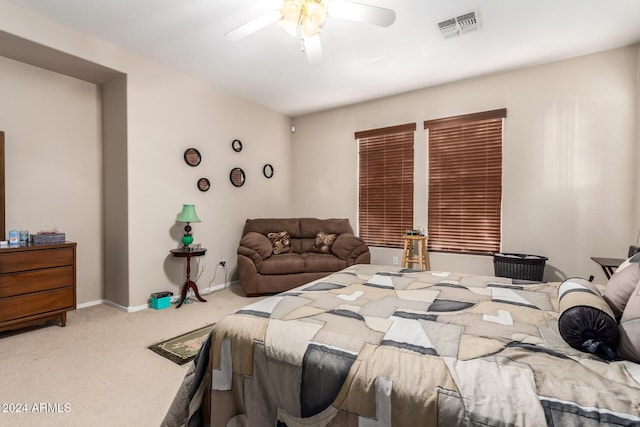 bedroom with ceiling fan and light colored carpet