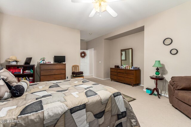 bedroom with ceiling fan and light colored carpet