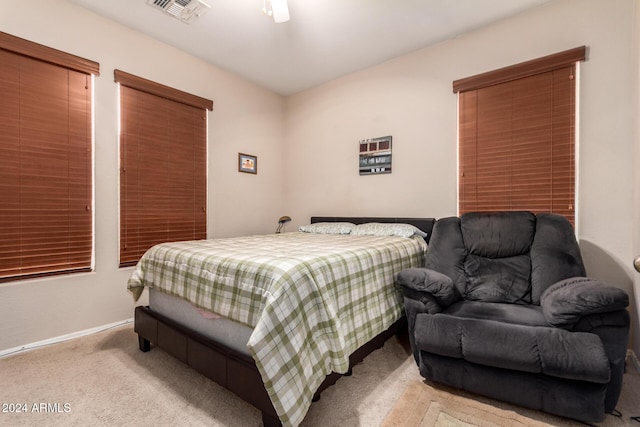 bedroom with light carpet and ceiling fan