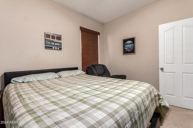 bedroom with light colored carpet