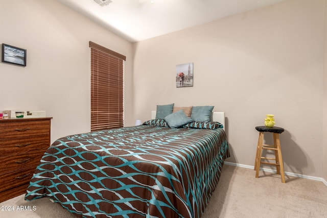 carpeted bedroom with lofted ceiling