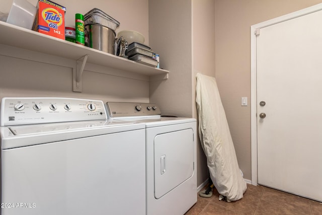 clothes washing area with tile patterned flooring and washing machine and clothes dryer