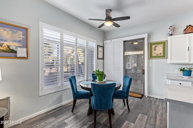 dining room featuring dark hardwood / wood-style floors and ceiling fan