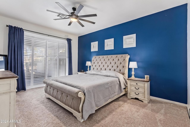 bedroom featuring ceiling fan and light colored carpet