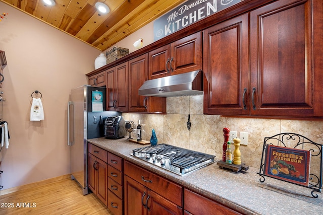 kitchen with backsplash, appliances with stainless steel finishes, light wood-type flooring, and wooden ceiling